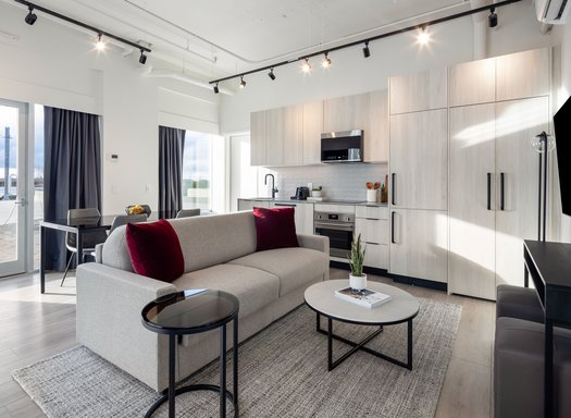 waterfront one bedroom suite features spacious living and dining area with the beautiful waterfront view