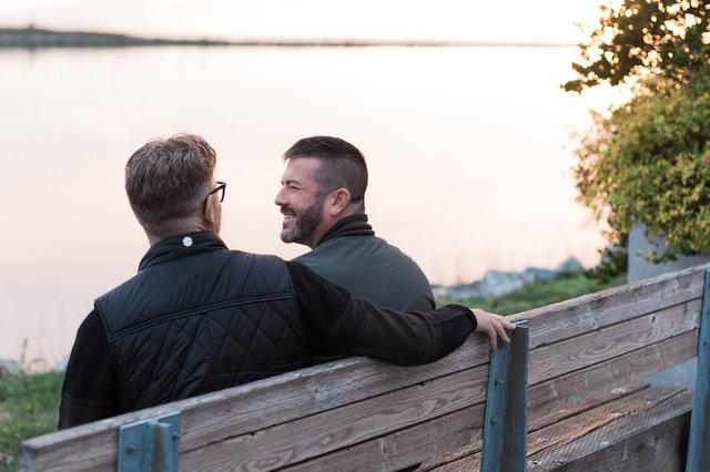 Steveston Waterfront Hotel-Couple staring lovingly at one another on the Steveston waterfront